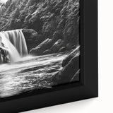 Framed canvas wall art showcasing a vibrant waterfall landscape design with rich blues and greens, perfect for enhancing home decor and creating a serene atmosphere.