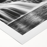 Vibrant rolled canvas artwork showcasing a serene waterfall landscape with lush greenery, ideal for home decor or office spaces, packaged securely in a sturdy tube.