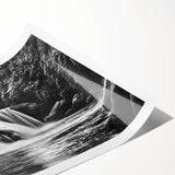 Vibrant rolled print of a serene waterfall landscape, showcasing cascading water and lush greenery, perfect for home decor and nature-inspired wall art.