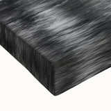 Close-up of a vibrant stretched canvas featuring a serene landscape with a cascading waterfall, rich greens, and blue hues, perfect for modern home decor.