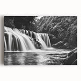 Stretched canvas wall art depicting a vibrant waterfall landscape, featuring lush green foliage and serene blue water, ideal for enhancing home decor.