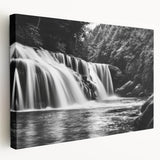 Stretched canvas wall art showcasing a serene landscape waterfall scene, featuring vibrant blue and green hues, perfect for adding a tranquil touch to home decor.