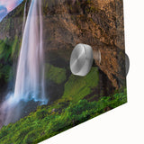 Close-up of a stunning acrylic wall art piece showcasing a vibrant waterfall landscape with lush greenery and blue skies, perfect for home decor enthusiasts.