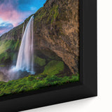 Close-up of a framed canvas wall art piece showcasing a vibrant waterfall landscape design, featuring rich blues and greens, ideal for home decor enhancement.