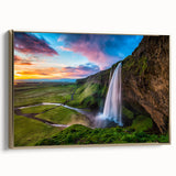 Framed canvas wall art showcasing a serene waterfall landscape with vibrant greens and blues, accented by a luxurious gold frame, ideal for home decor.