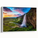 Framed canvas wall art showcasing a serene waterfall landscape design with vibrant colors and intricate details, elegantly displayed against a white background.