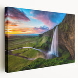 Stretched canvas wall art showcasing a vibrant waterfall landscape design, featuring rich blues and greens, ideal for enhancing any home decor.