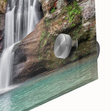 Close-up of a vibrant acrylic glass wall art piece showcasing a serene waterfall landscape, featuring rich blue and green hues. Perfect for enhancing modern home decor.