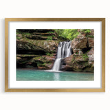 Framed wall art of a serene waterfall landscape, featuring a gold mat and elegant frame, perfect for enhancing home decor with natural beauty and tranquility. Ideal for nature lovers seeking a calming aesthetic.