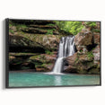 Framed canvas wall art showcasing a serene waterfall landscape, featuring vibrant blues and greens, with a sleek black frame, ideal for home decor.