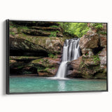Framed canvas wall art showcasing a serene waterfall landscape, featuring vibrant blues and greens, with a sleek black frame, ideal for home decor.