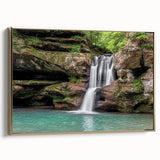 Framed canvas wall art showcasing a serene waterfall landscape in vibrant colors, accented with a gold frame, perfect for home decor enhancement.