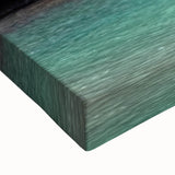 Close-up of a vibrant, stretched canvas featuring a stunning landscape waterfall design, showcasing rich blues and greens, perfect for enhancing home decor.