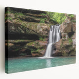Stretched canvas artwork showcasing a vibrant waterfall landscape, framed elegantly for wall display. Perfect for home decor, evoking tranquility and nature's beauty.