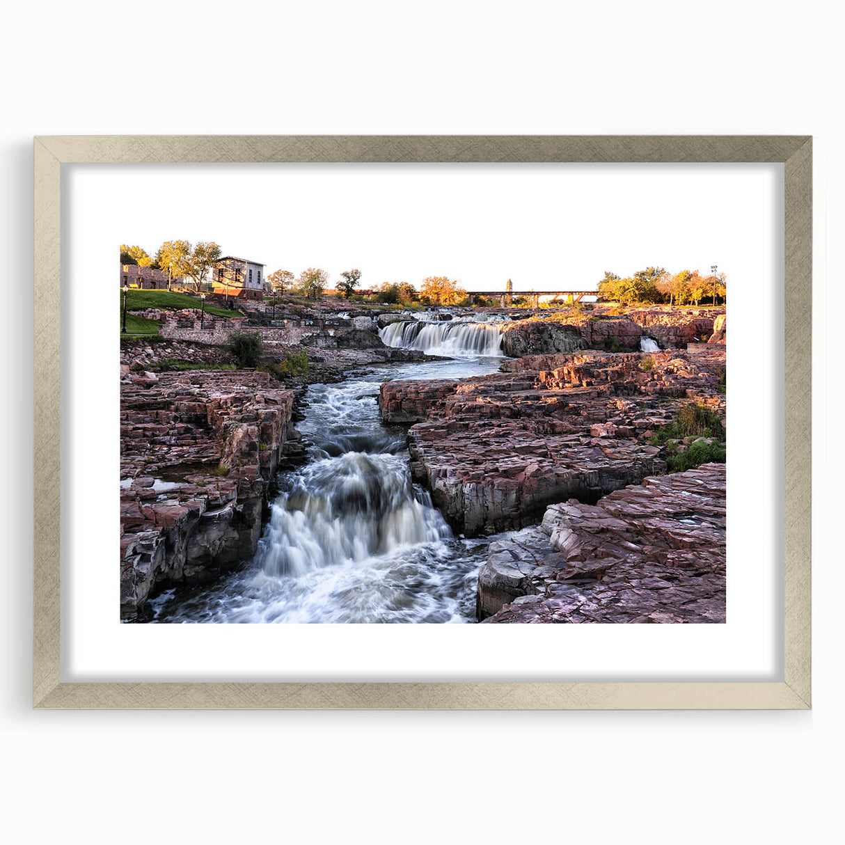 Framed wall art collection featuring a serene landscape with waterfalls, presented in a silver frame with matting, ideal for enhancing home decor.