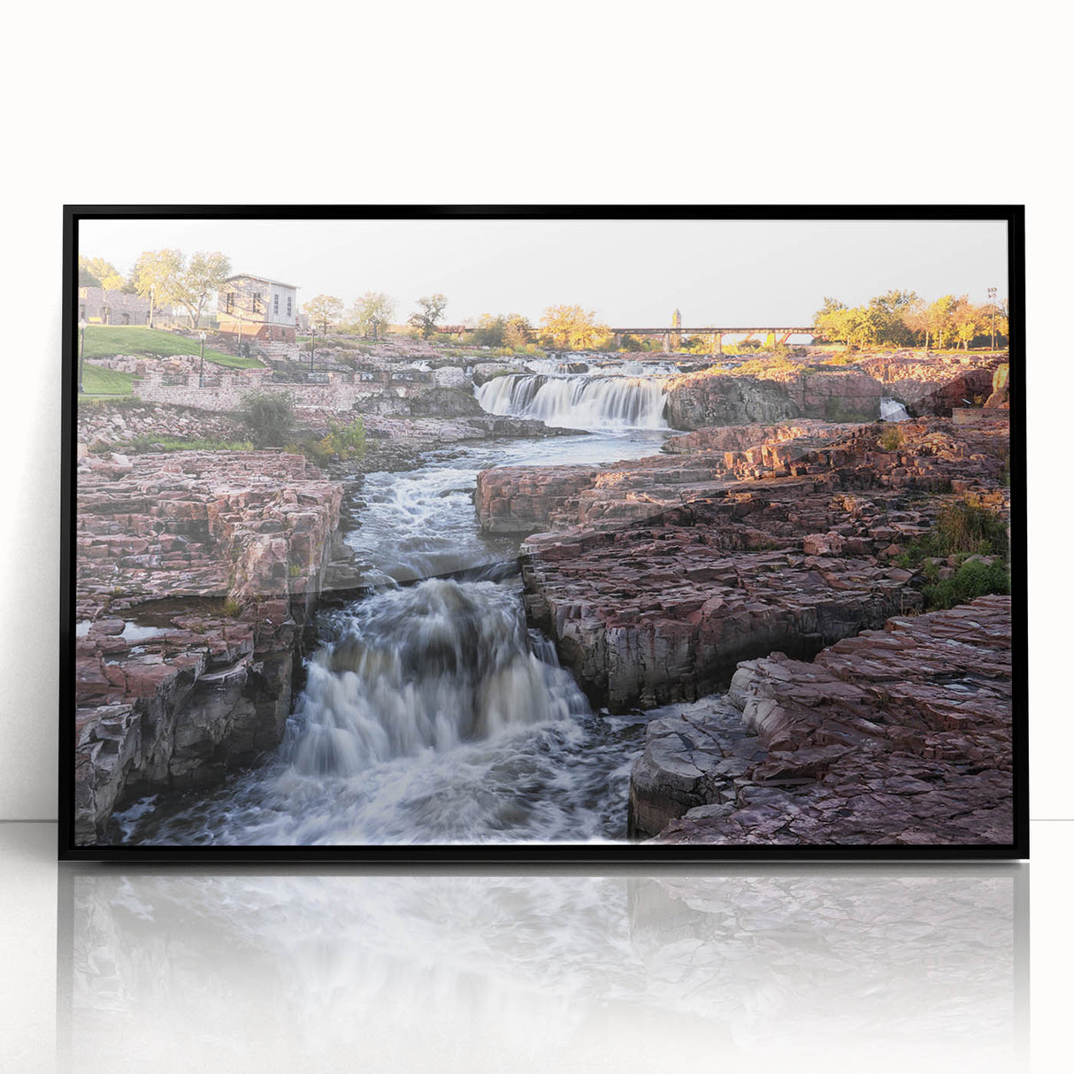 Framed acrylic wall art showcasing a stunning waterfall landscape design with vibrant colors, set in a sleek black frame, perfect for enhancing home décor.