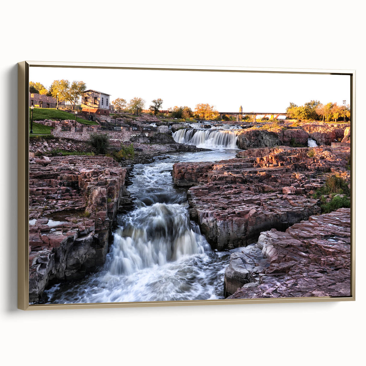 Framed canvas wall art collection showcasing a serene landscape with cascading waterfalls, set against a gold border, ideal for modern home decor.