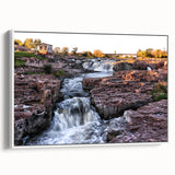 Framed canvas wall art showcasing a serene waterfall landscape design, featuring vibrant blues and greens, displayed in a white frame from a side view, perfect for enhancing home decor.