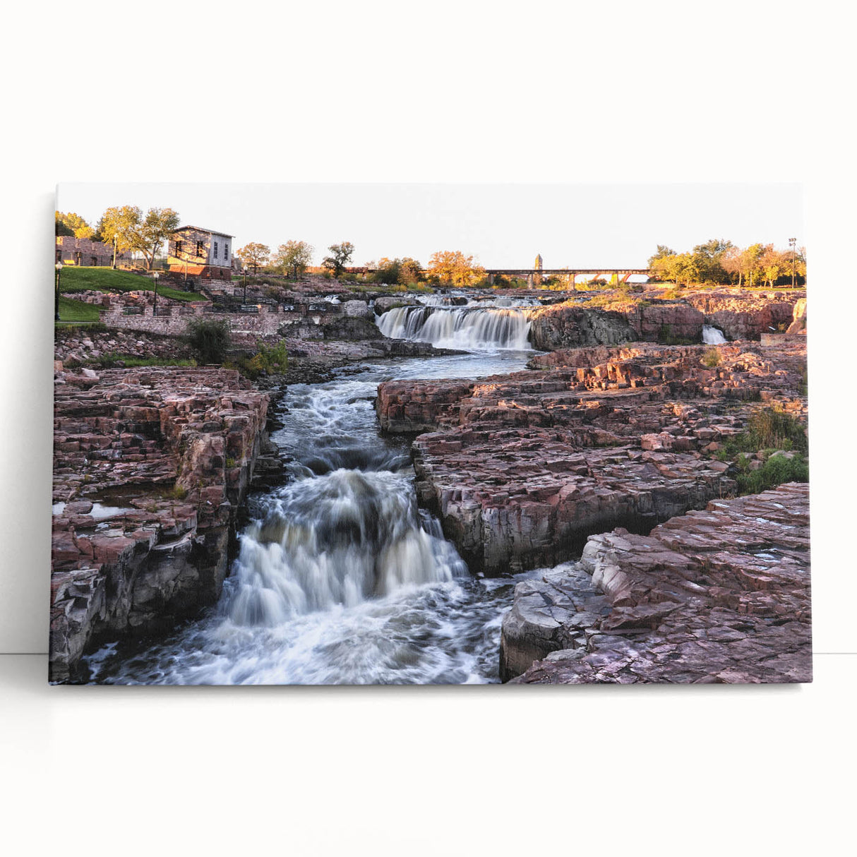 Stretched canvas wall art featuring a vibrant waterfall landscape design with lush greenery, ideal for home decor, adding tranquility and natural beauty to any space.