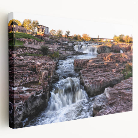 Stretched canvas wall art showcasing a serene waterfall landscape design, emphasizing vibrant blues and greens, ideal for home decor and relaxation.