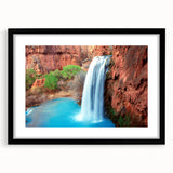 Framed wall art featuring a serene landscape of cascading waterfalls, surrounded by lush greenery, with a sleek black frame and matting, perfect for home decor.