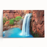 Vibrant stretched canvas artwork showcasing a serene waterfall landscape, perfect for home decor, featuring lush greenery and a tranquil blue water scene. Ideal for nature lovers and interior design enthusiasts.
