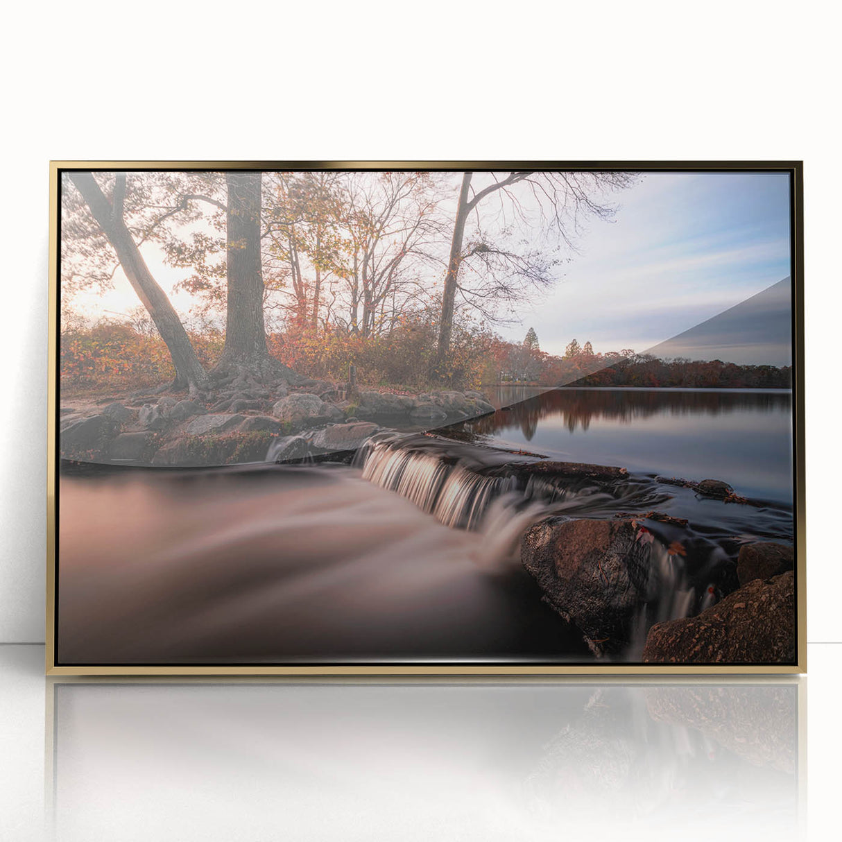Framed acrylic wall art featuring a vibrant waterfall landscape design with golden accents, ideal for enhancing interior decor in living spaces.
