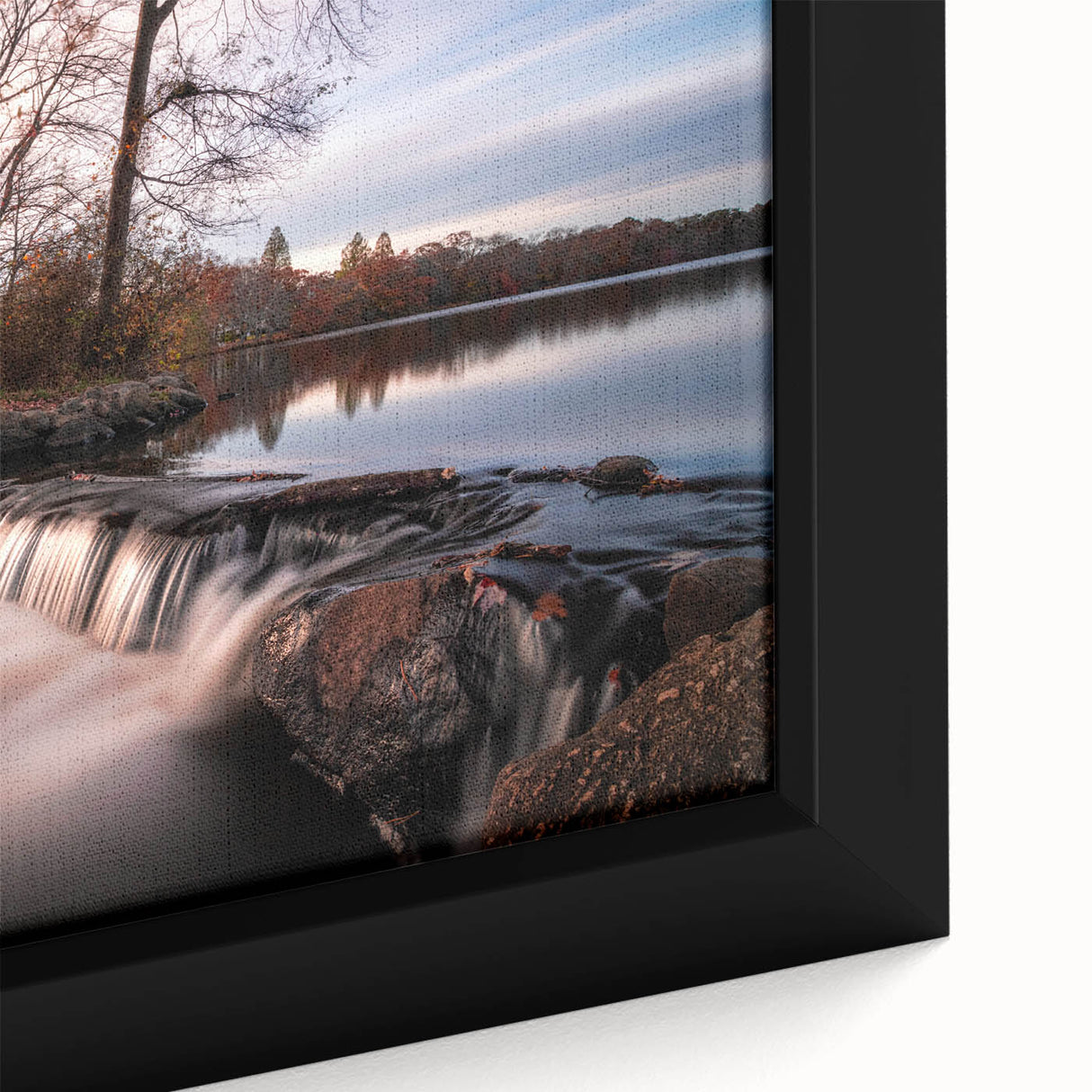 Close-up of a framed canvas wall art piece showcasing a vibrant waterfall landscape design, featuring rich blues and greens, perfect for home decor.