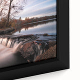Close-up of a framed canvas wall art piece showcasing a vibrant waterfall landscape design, featuring rich blues and greens, perfect for home decor.