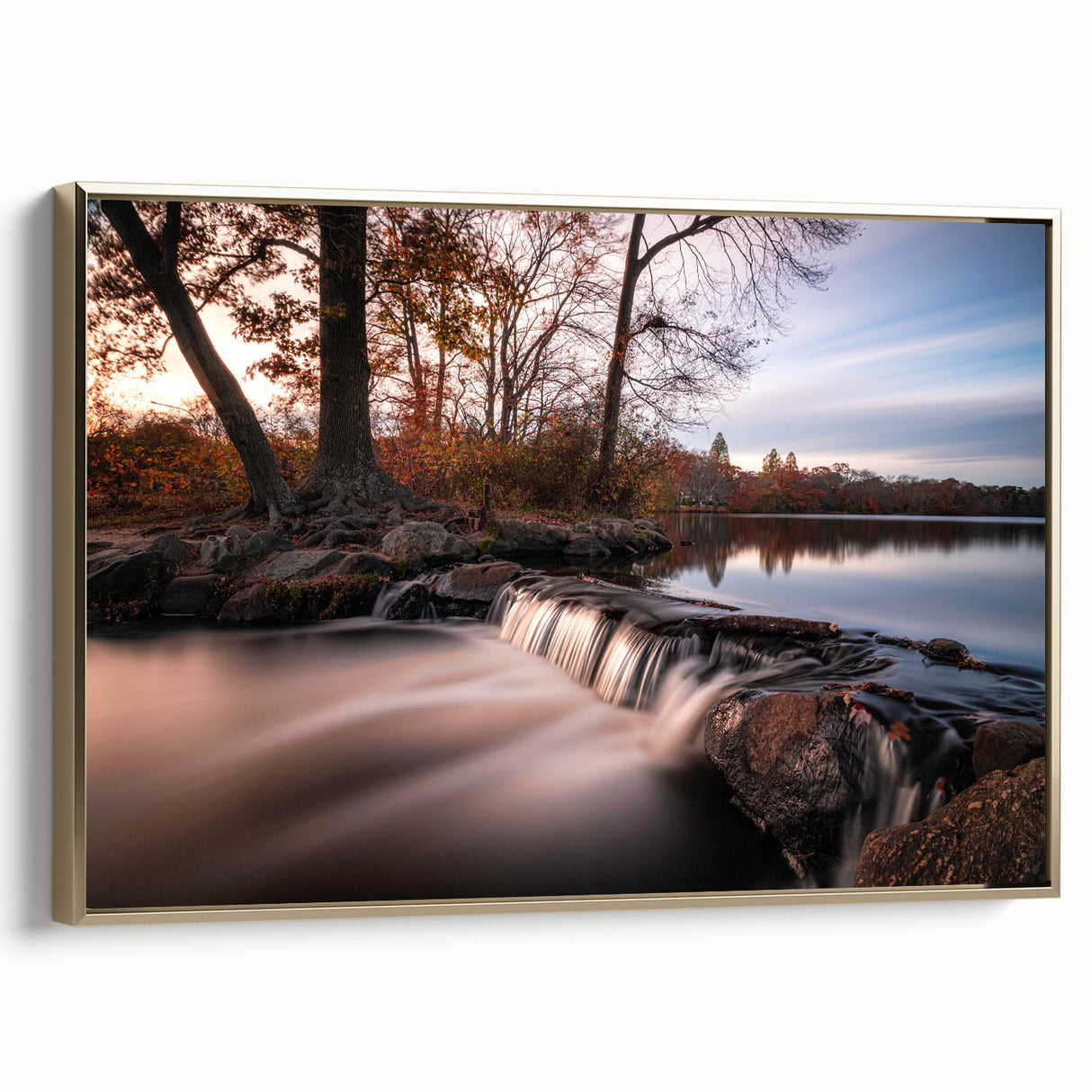 Framed canvas wall art showcasing a vibrant waterfall landscape with lush greenery and golden accents, ideal for enhancing home decor aesthetics.