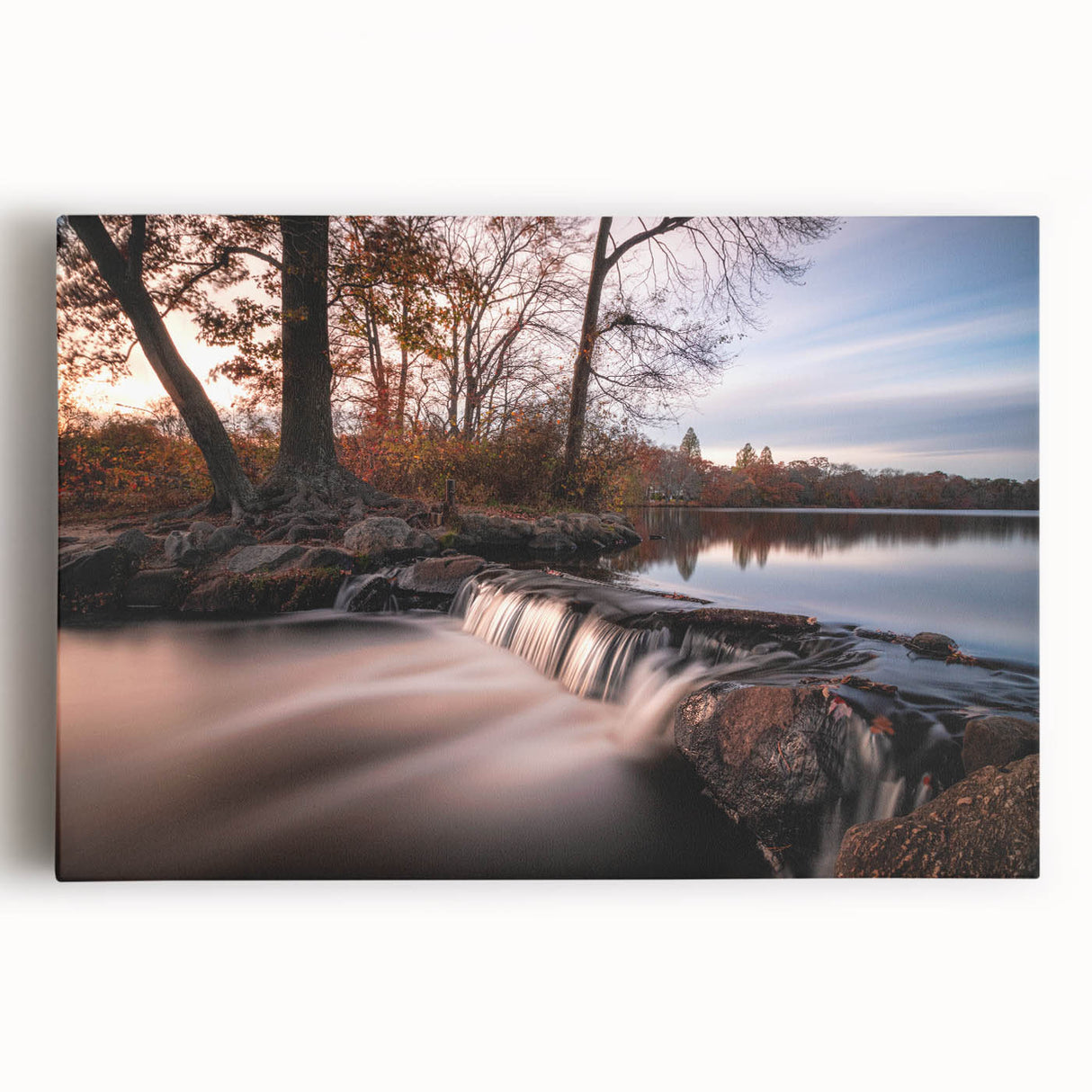 Stretched canvas wall art showcasing a vibrant waterfall landscape design with lush greenery and cascading water, perfect for enhancing home decor.