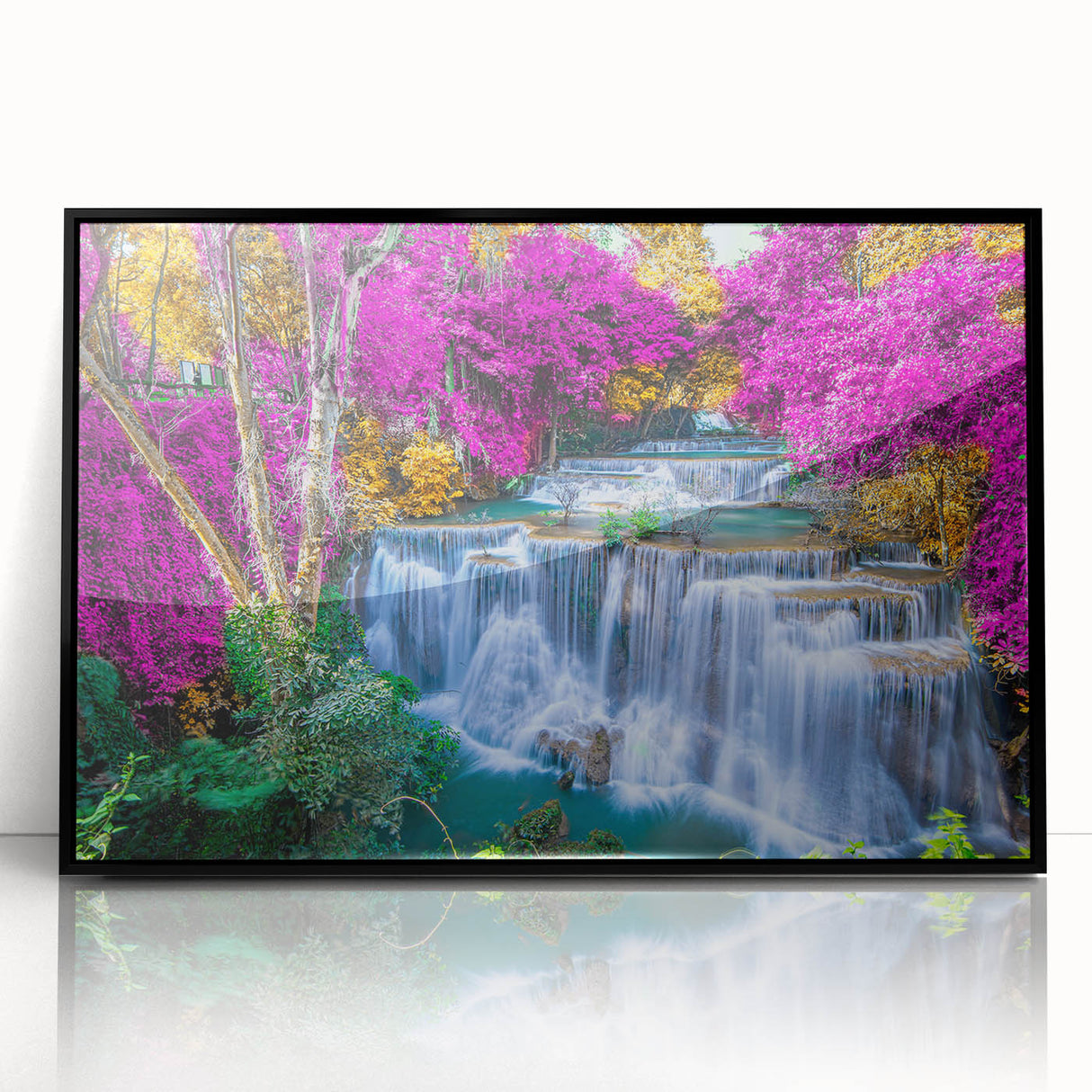 Framed wall art featuring a stunning waterfall landscape design, showcasing vibrant blue water cascading down rocky cliffs, set in a sleek black frame for elegant decor.