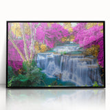 Framed wall art featuring a stunning waterfall landscape design, showcasing vibrant blue water cascading down rocky cliffs, set in a sleek black frame for elegant decor.