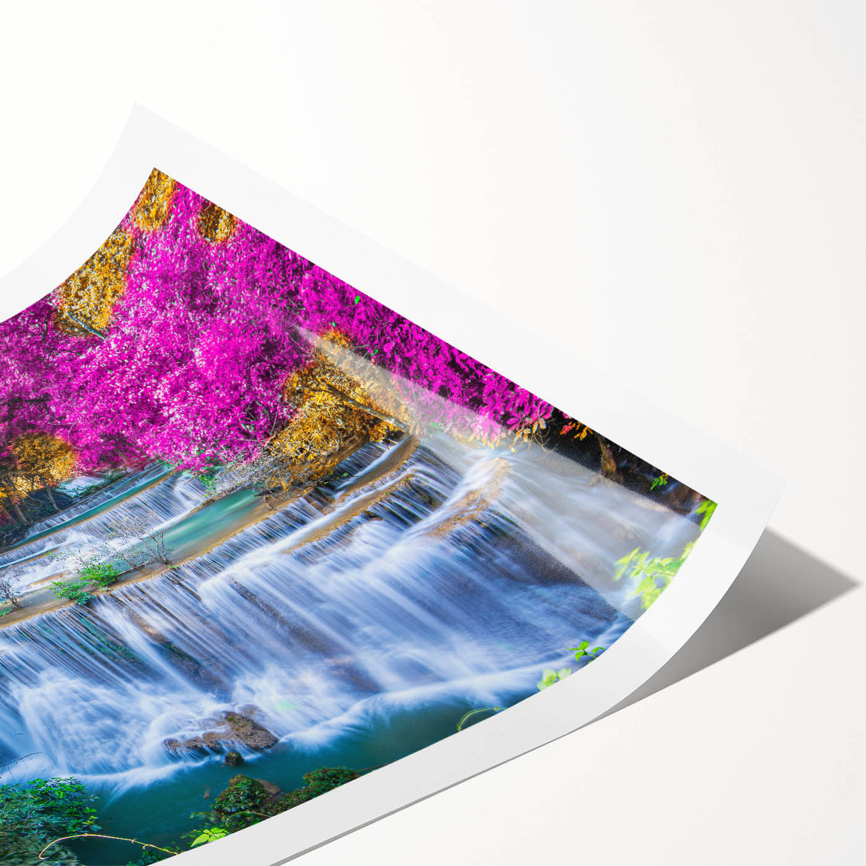 Rolled print showcasing a vibrant waterfall landscape, featuring lush greenery and cascading water. Ideal for nature-themed decor, packaged securely in a tube.