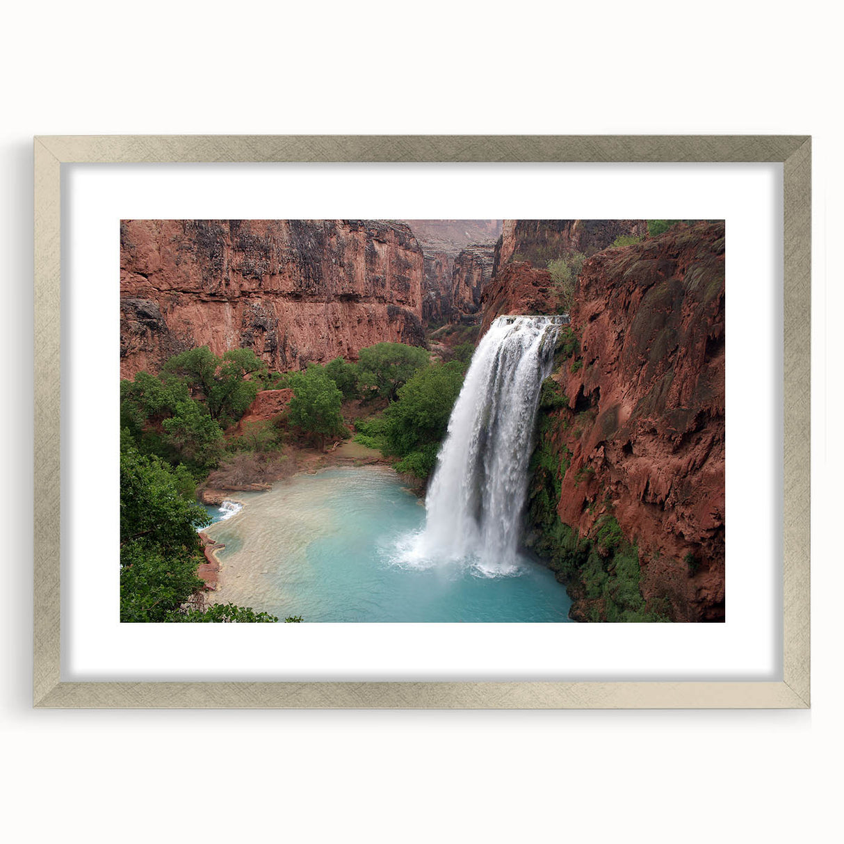 Framed wall art featuring a serene waterfall landscape in vibrant colors, surrounded by a silver mat and frame, perfect for home decor and nature enthusiasts.