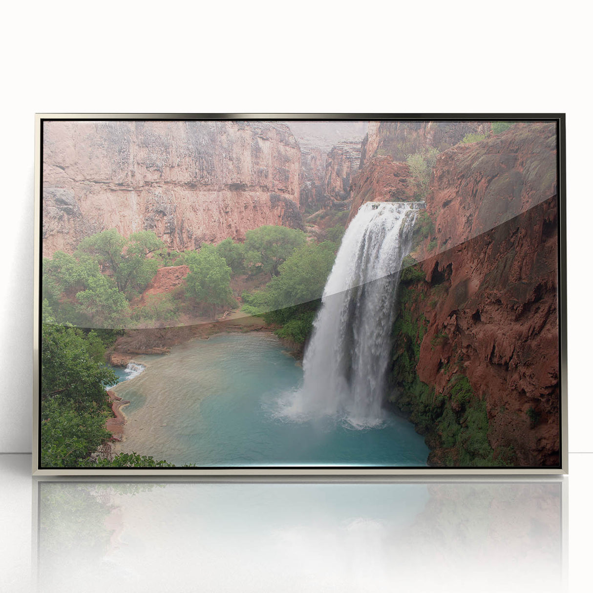 Framed wall art showcasing a serene waterfall landscape design in acrylic with a silver finish, perfect for home decor, enhancing tranquil environments.