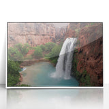 Framed acrylic wall art depicting a serene waterfall landscape with lush greenery, showcasing vibrant colors and intricate details, perfect for home decor.