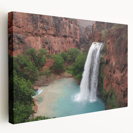 Stretched canvas wall art showcasing a vibrant landscape with a cascading waterfall, surrounded by lush greenery, ideal for enhancing home decor.