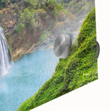 Close-up of a vibrant acrylic wall art piece showcasing a stunning waterfall landscape, featuring rich blues and greens that evoke tranquility, perfect for home decor.
