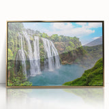 Framed acrylic wall art showcasing a serene waterfall landscape with vibrant green foliage and golden accents, perfect for enhancing home decor.
