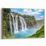 Framed canvas wall art showcasing a stunning waterfall landscape design with vibrant blues and greens, accented by a sleek gold frame, ideal for modern home decor.