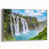 Framed canvas wall art showcasing a serene waterfall landscape design with silver accents, perfect for home decor. The artwork captures vibrant colors and natural beauty, enhancing any interior space.