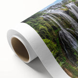 Beautiful rolled canvas artwork showcasing a serene waterfall landscape in vibrant colors, perfect for home decor. Packaged securely in a protective tube for delivery.