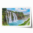 Vibrant rolled print showcasing a stunning waterfall landscape, featuring cascading water and lush greenery, perfect for home decor and nature lovers.