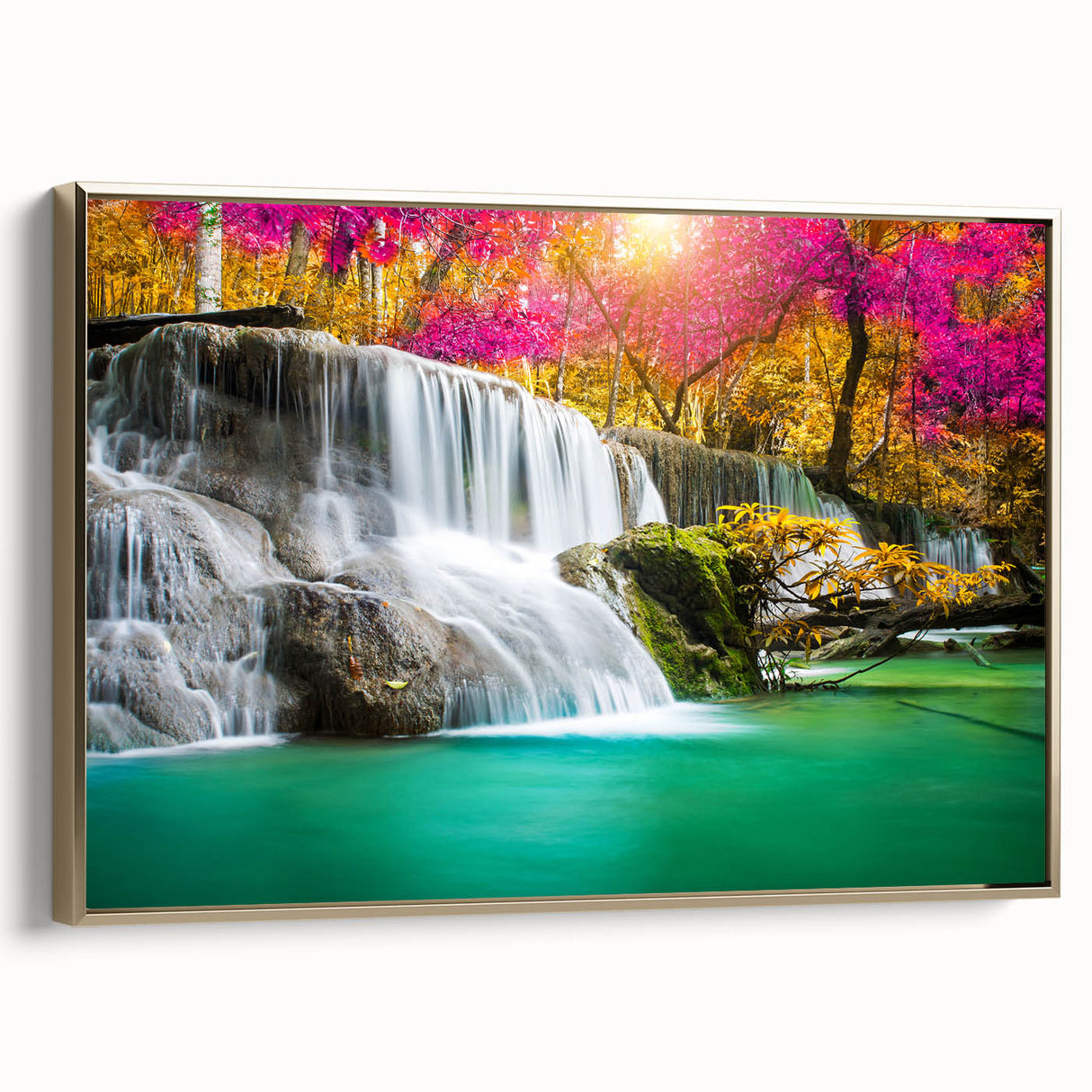 Framed canvas wall art depicting a serene waterfall landscape with lush greenery, elegant gold accents, and a modern design that enhances any decor.