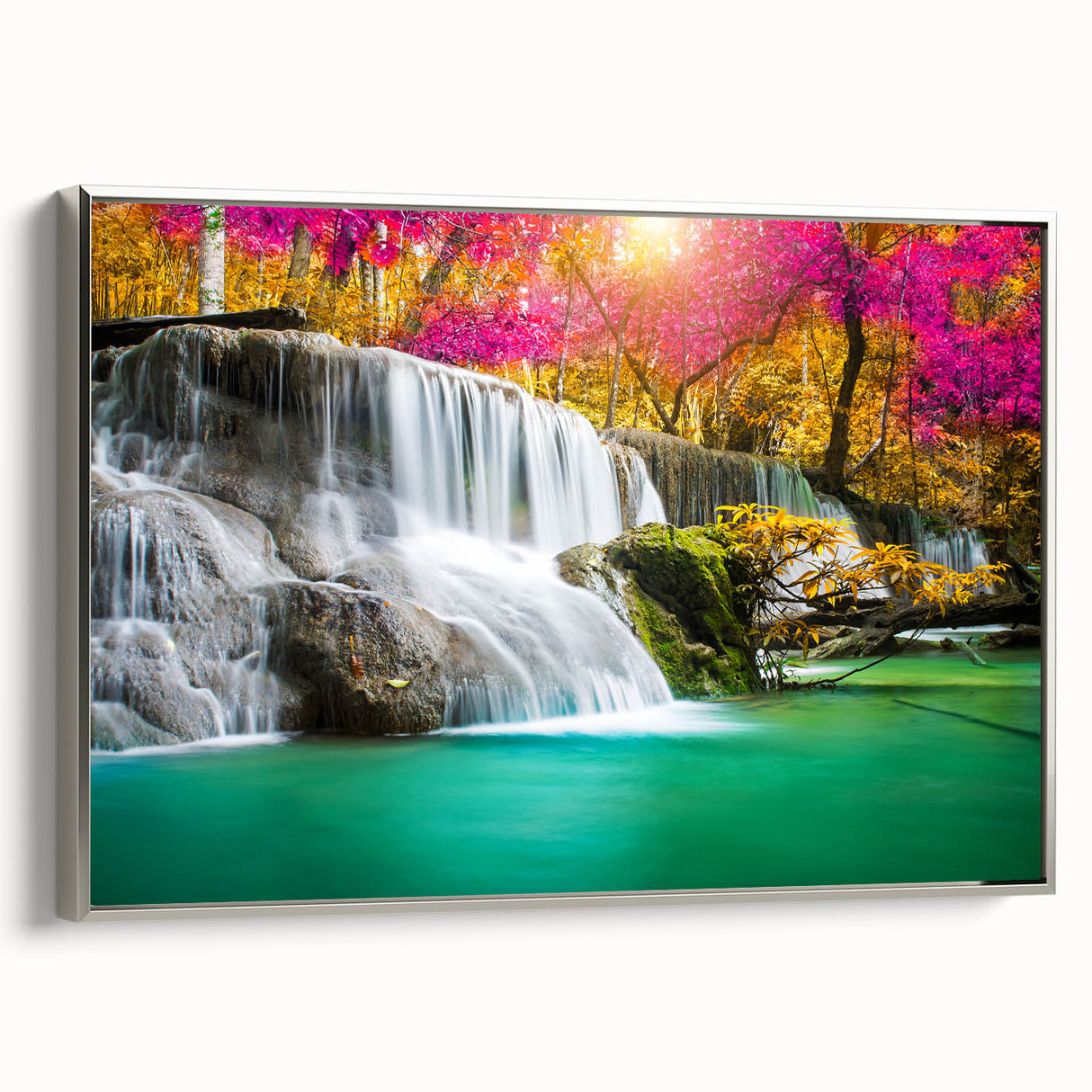 Framed wall art collection showcasing a stunning landscape of cascading waterfalls, set against a serene natural backdrop, with a sleek silver frame highlighting the vibrant colors.