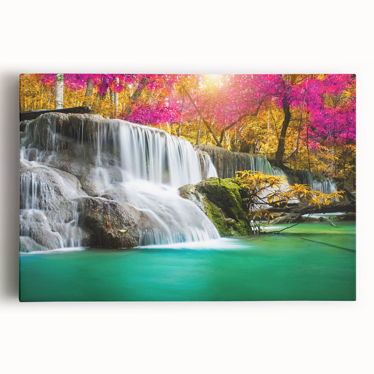 Stretched canvas wall art featuring a serene landscape scene of a cascading waterfall surrounded by lush greenery, perfect for enhancing home decor with nature-inspired aesthetics.