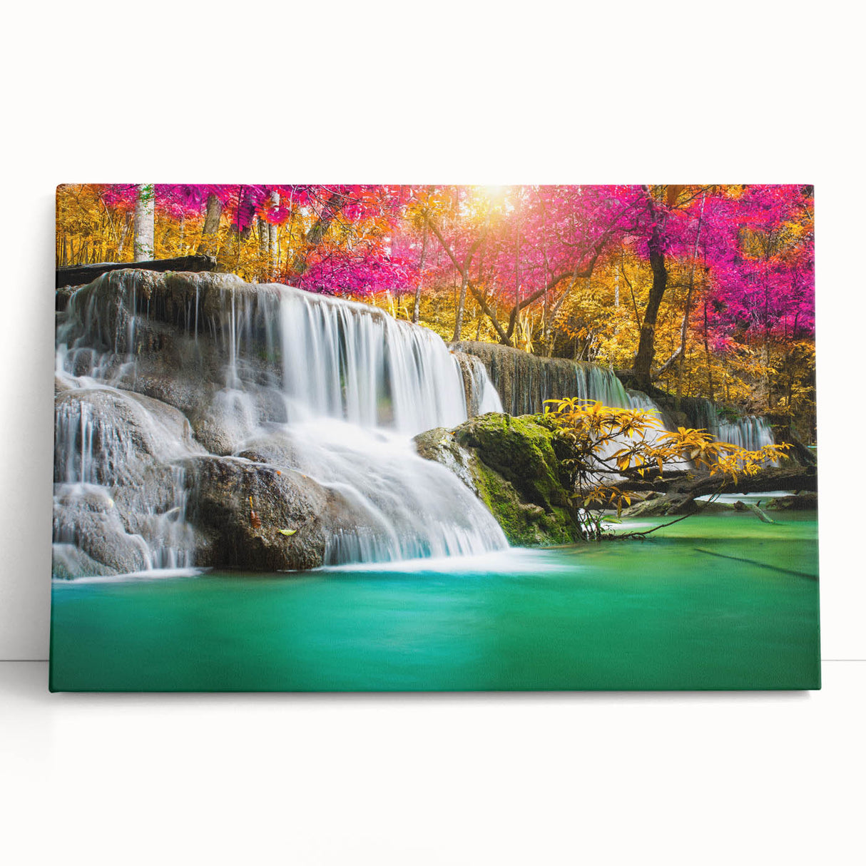 Stretched canvas wall art showcasing a serene waterfall landscape, featuring vibrant blue water and lush greenery, perfect for nature-inspired decor.