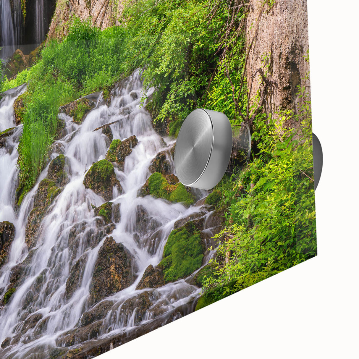 Close-up of a vibrant acrylic glass wall art piece showcasing a serene waterfall landscape, featuring lush greenery and cascading water, designed to enhance home decor.
