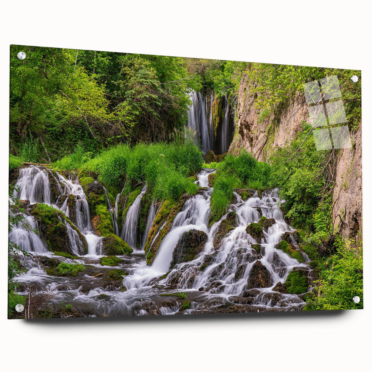 Acrylic glass wall art featuring a serene waterfall landscape design, displayed in a side view with visible mounting pins, perfect for home decor. The vibrant colors and intricate details enhance any space, making it an ideal choice for nature lovers.